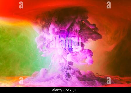 Flowing purple, violet ink in water background. Beautiful abstract colorful patterns. Stock Photo