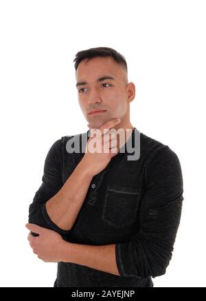 Young businessman standing in a black shirt thinking Stock Photo