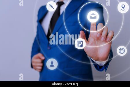 Male human presenting a presentation using the latest sophisticated devices. Man wear formal working suit introducing how smart Stock Photo