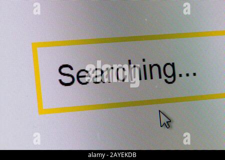 Word Searching in search bar on computer monitor Stock Photo
