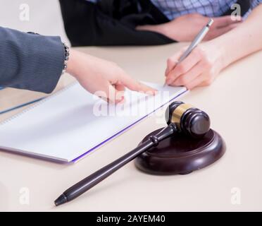 Injured employee visiting lawyer for advice on insurance Stock Photo