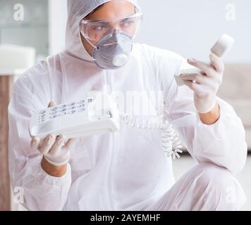Forensic expert at crime scene doing investigation Stock Photo