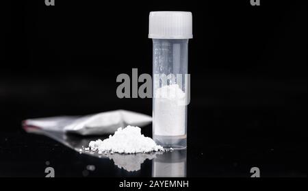 Cocaine on a dark plate as detailed close-up shot Stock Photo