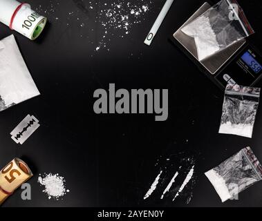 Cocaine on a dark plate as detailed close-up shot Stock Photo