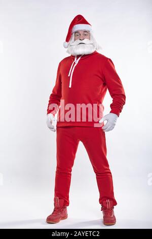 Portrait of a Santa Claus in red sportsware in full growth Stock Photo