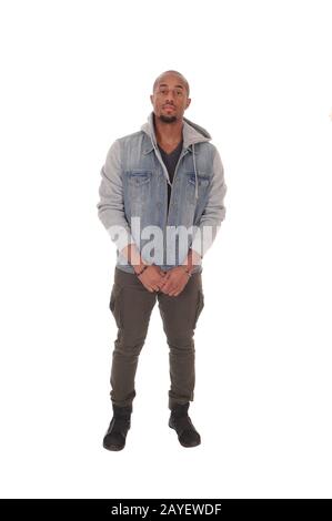 African man standing relaxed in a jeans jacket Stock Photo
