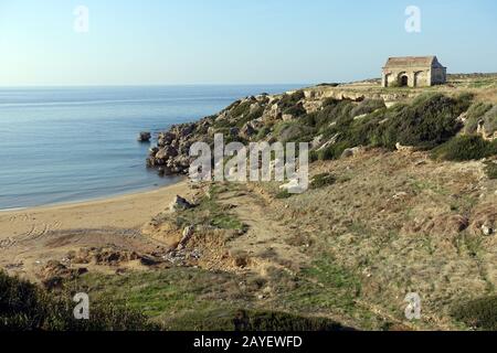 Desecrated church over a small beach at Kaplica (greek Davlos) Stock Photo