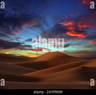 sand dunes in desert at sunset Stock Photo