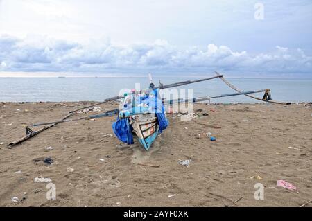 Fishing boat on the beach at Padang Sumatra Indonesia Stock Photo