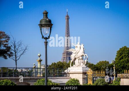 Marble statue and Eiffel Tower view from the Tuileries Garden, Paris Stock Photo