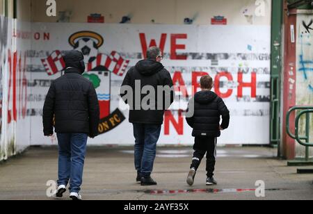 Fans make their way to the ground prior to the Premier League match at St Mary's Stadium, Southampton. Stock Photo