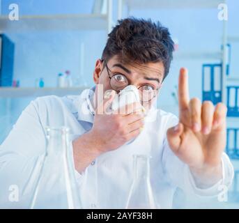 Funny mad chemist working in a laboratory Stock Photo