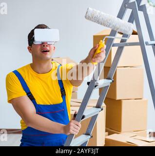 Painter contractor working with virtual reality goggles Stock Photo