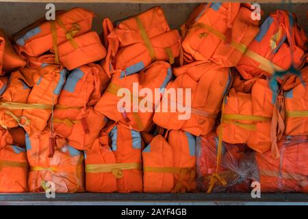 Pile of life vests for passengers on the boat Stock Photo