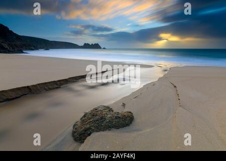 Porthcurno Beach in West Cornwall captured at sunrise. Stock Photo