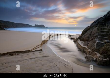 Porthcurno Beach in West Cornwall captured at sunrise. Stock Photo