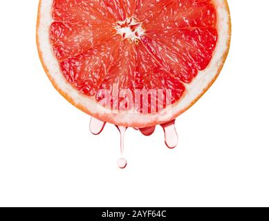 Ripe grapefruit and drops of juice Stock Photo