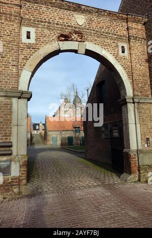 Archway at the entrance to Kühlseggen castle, Weilerswist, North Rhine-Westphalia, Germany