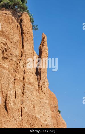 Effects of seaside coastal erosion with clayey soil Stock Photo