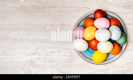 Plate full of multi coloured and mottled Easter eggs Stock Photo