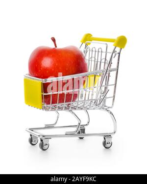 Apple in shopping cart Stock Photo