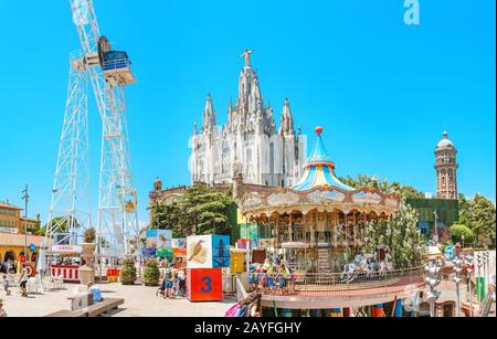 12 JULY 2018, BARCELONA, SPAIN: Amusement Park and Church at Tibidabo hill Stock Photo