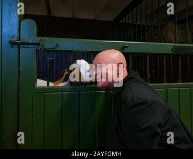 Edinburgh, Scotland, United Kingdom, 15 February 2020. Gorgie City Farm: Gail Porter, who has childhood memories of visiting the farm meets the new LOVE Gorgie. LOVE Learning, an education and social care charity supporting vulnerable individuals announced its take over of the city farm in January 2019.  The farm will reopen on February 29th 2020. Gail meets one of the farm's goats Stock Photo