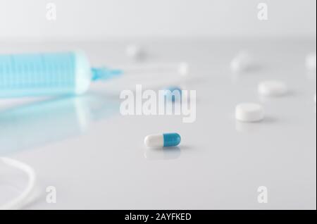 Medical treatment and syringe with  medical drug for heath therapy. Selective focus. Pain,health, . Illness, medical concept. Horizontal. Stock Photo
