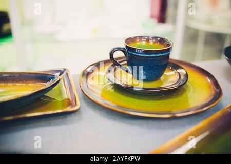 Designer handmade dishes, plates and cups in a stylish boutique Stock Photo