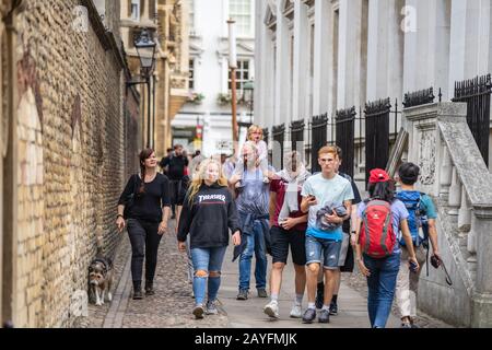 Cambridge, UK, August 1, 2019. Turists walking down and taking pictures at the street of Cambridge on a busy sunny day in front of Kings College Stock Photo