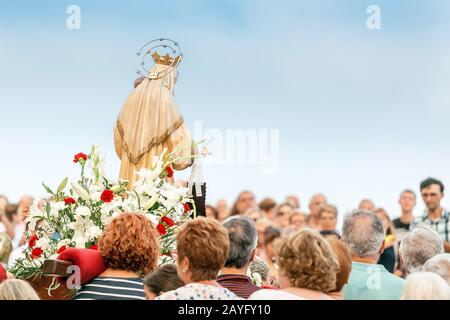 15 JULY 2018, TARRAGONA, SPAIN: People at celebration of religious holiday with Virgin Mary Stock Photo