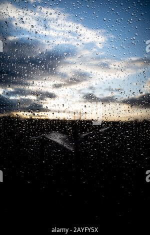 Raindrops on a window, after a downpour in Wallington, Surrey. Stock Photo