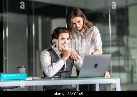 Business people Having Meeting Around Table In Modern Office Stock Photo