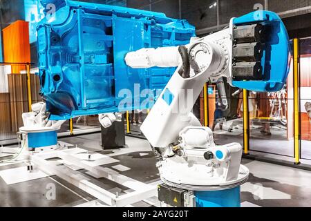 Industrial automated robotic arm working in car factory Stock Photo