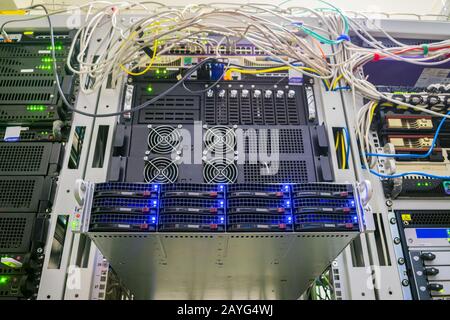 The cloud storage server is installed in the datacenter rack. Concept of modern Internet technologies Stock Photo