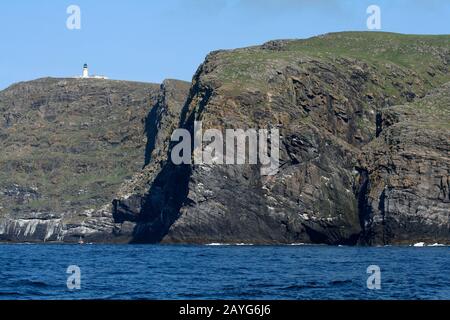 Barra Head lighthouse, highest light in the UK, from the sea, Berneray, Western Isles, Scotland Stock Photo