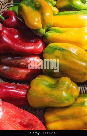 red and yellow chilli peppers on display at a market stall selling fruits and vegetables at borough market, southwark, central london, uk Stock Photo