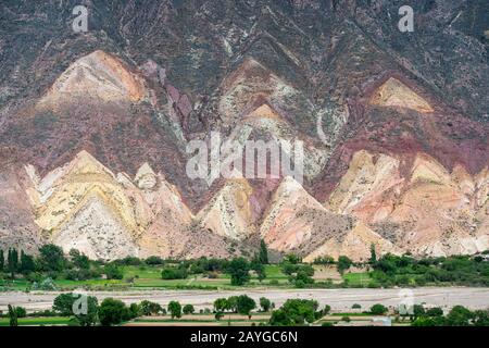 View of colorful rock formations and erosion near Tilcara in the valley of Quebrada de Humahuaca, Andes Mountains, Jujuy Province, Argentina. Stock Photo