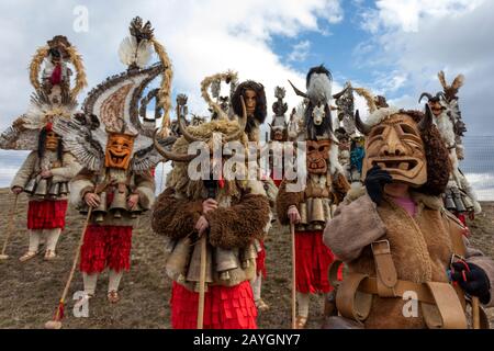 Elin Pelin, Bulgaria - February 15, 2020: Masquerade festival in Elin Pelin Bulgaria. People with a mask called Kukeri dance and perform to scare the Stock Photo