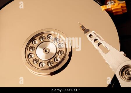 Disassembled hard drive from the computer, hdd with mirror effect. Opened hard drive from the computer hdd with mirror effects. data recovery concept Stock Photo