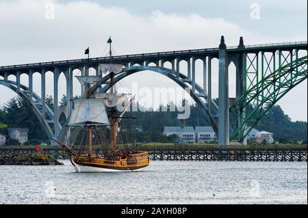 Newport,Oregon,USA - May 25,2016:  Tall ship the Hawaiian Cheiftan leaves port at Newport, Oregon  raising sails for an evening sail in Yaquina Bay ba Stock Photo