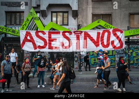 Protesters on the streets around Plaza de Italia during recent demonstrations against the government in Santiago, Chile. Stock Photo