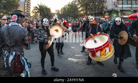 Peaceful protesters performing on the streets around Plaza de Italia during recent demonstrations against inequality in Santiago de Chile. Stock Photo