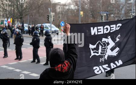 Dresden, Germany. 15th Feb, 2020. Participants of a protest action against a right-wing march are standing on the edge of a demonstration. The occasion is the anniversary of the destruction of Dresden in 1945. Credit: Sebastian Willnow/dpa-Zentralbild/dpa/Alamy Live News Stock Photo