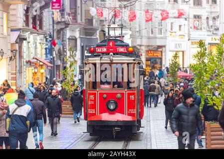 ISTANBUL - JAN 01: Famous retro red Tram on on Taksim Square and Istiklal Street in Istanbul on January 01. 2020 in Turkey Stock Photo