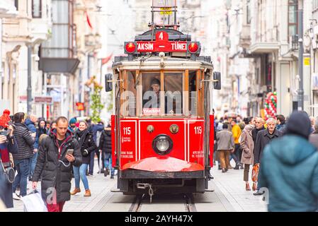 ISTANBUL - JAN 01: Famous retro red Tram on on Taksim Square and Istiklal Street in Istanbul on January 01. 2020 in Turkey Stock Photo