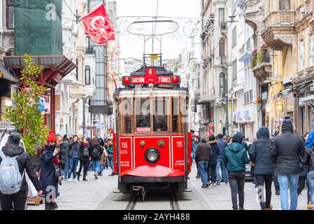 ISTANBUL - JAN 01: Famous retro red Tram on on Taksim Square and Istiklal Street in Istanbul on January 01. 2020 in Turkey Stock Photo