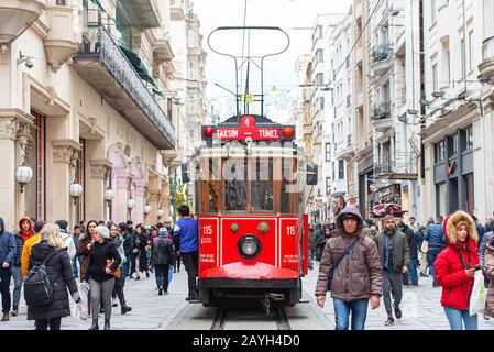 ISTANBUL - JAN 01: Famous retro red Tram on on Taksim Square and Istiklal Street in Istanbul on January 01. 2020 in Turkey Stock Photo