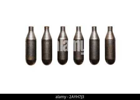 Six soda Chargers with carbon dioxide for making gas in water, isolated on a white background with a clipping path. Stock Photo