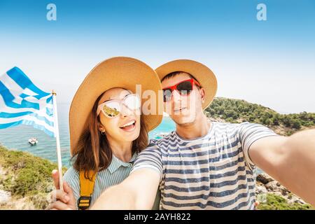 Couple European man and an Asian woman came on a vacation honeymoon to the Greek island resort Stock Photo